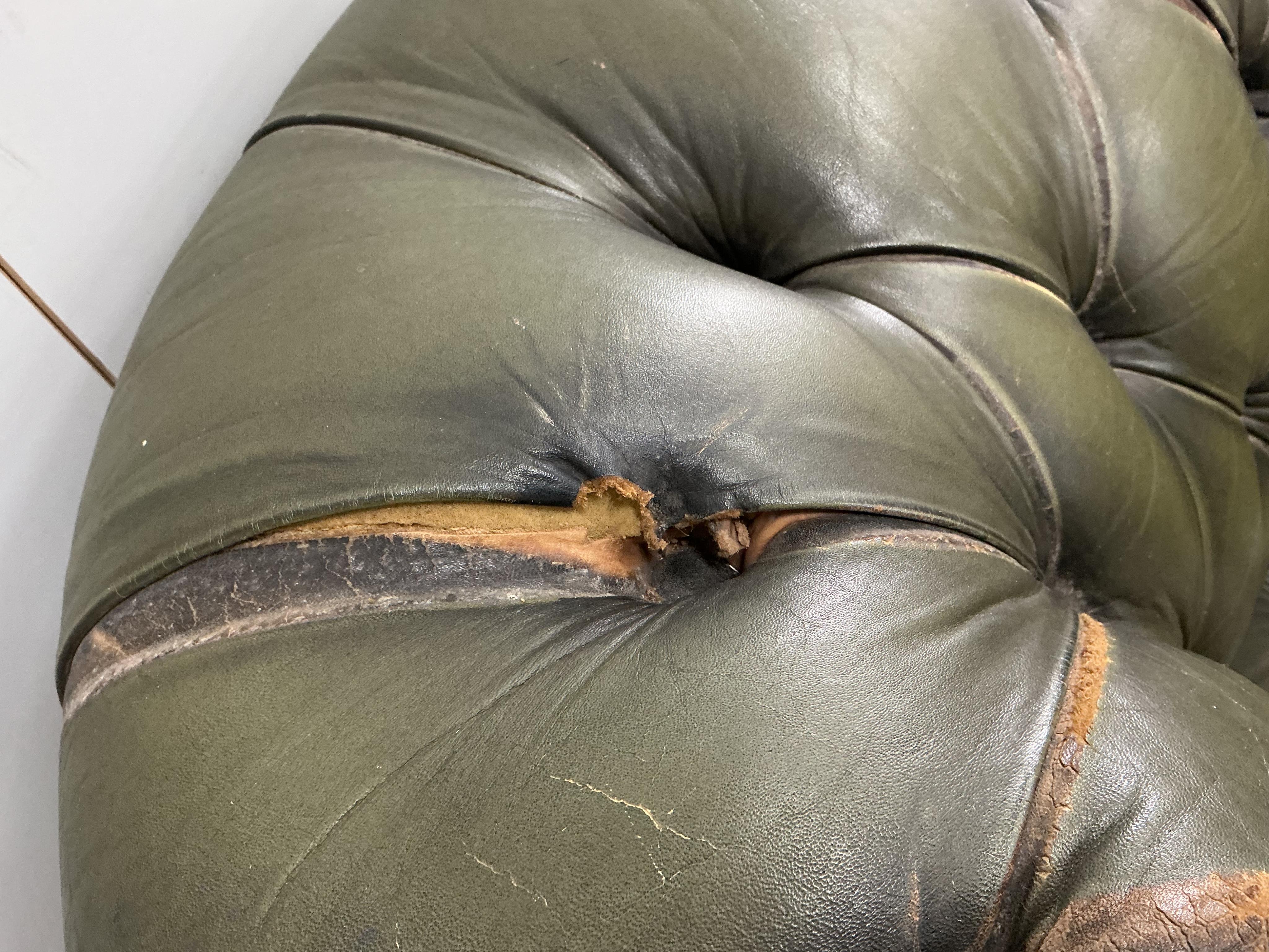 A pair of Chesterfield style buttoned green leather club armchairs, width 104cm, depth 92cm, height 74cm